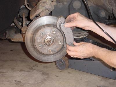 Image result for changing brake pads.