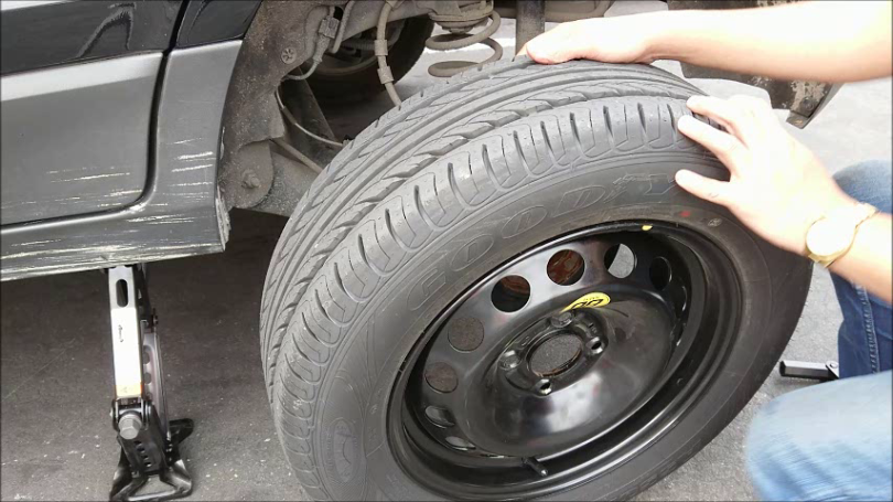 Image result for changing flat tire